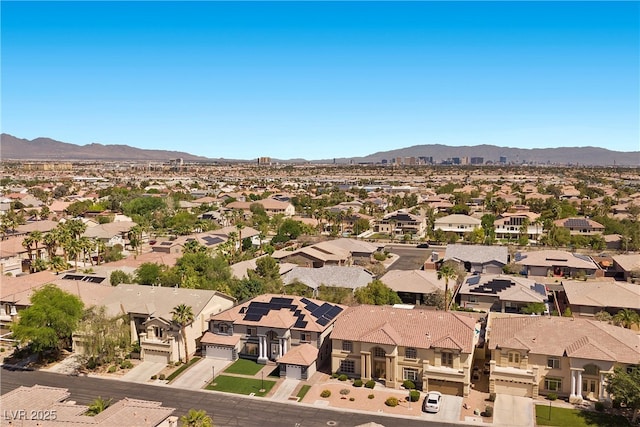 aerial perspective of suburban area featuring a mountainous background