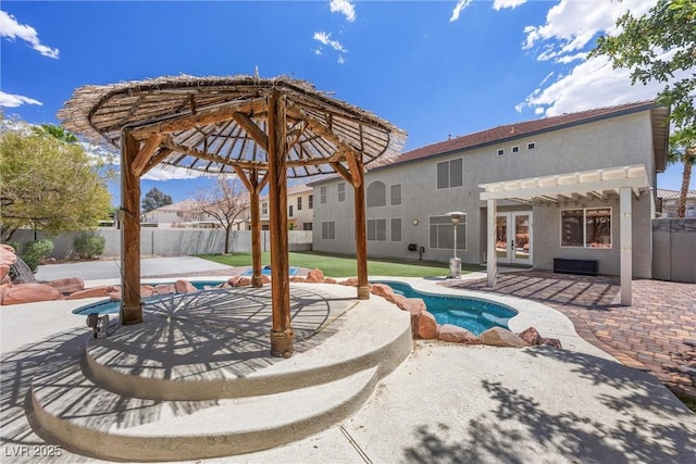 view of swimming pool featuring a pergola, a fenced backyard, a patio, and french doors