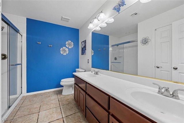 358 Whispering Tree Ave, Las Vegas, NV 89183 - bathroom with a shower stall, toilet, double vanity, and baseboards