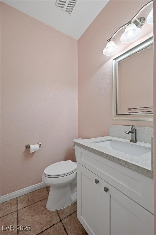 358 Whispering Tree Ave, Las Vegas, NV 89183 - half bath featuring toilet, vanity, baseboards, and tile patterned flooring