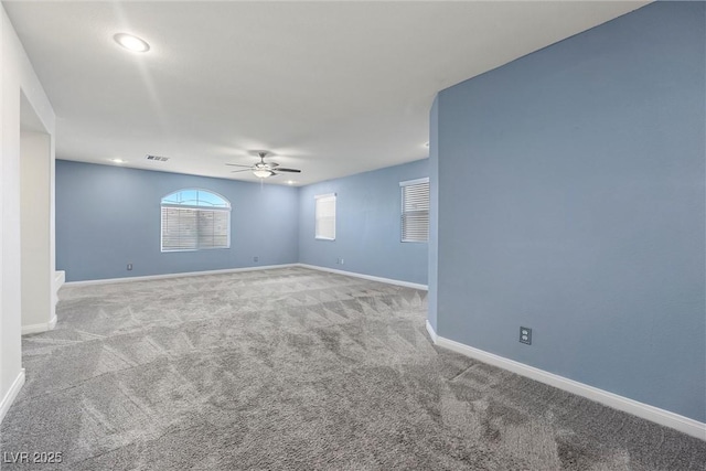 spare room featuring a ceiling fan, carpet flooring, baseboards, and recessed lighting