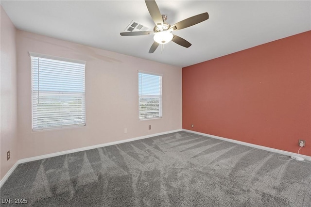 empty room featuring carpet, a ceiling fan, and baseboards