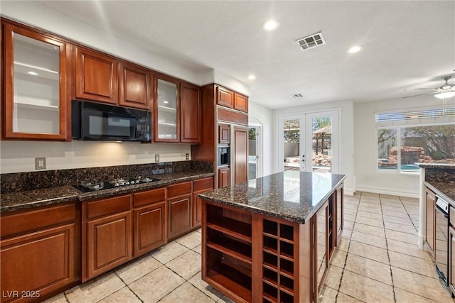 kitchen with black appliances, light tile patterned floors, recessed lighting, open shelves, and dark stone countertops