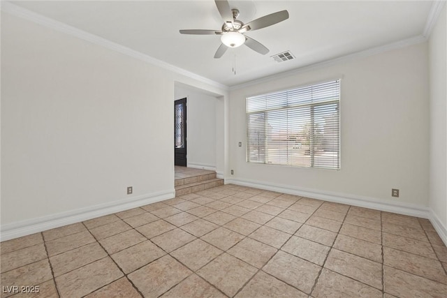 spare room with ornamental molding, light tile patterned flooring, ceiling fan, and baseboards