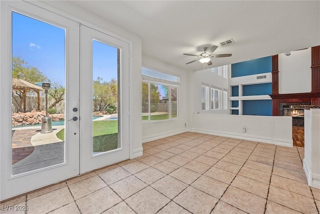 unfurnished sunroom with french doors