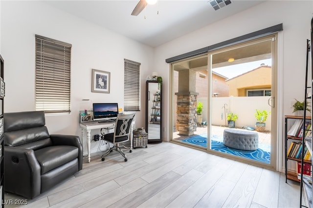 778 Dainty Daffodil St, Henderson, NV 89011 - home office with ceiling fan, wood finished floors, ornate columns, and plenty of natural light