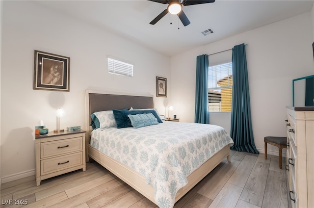 778 Dainty Daffodil St, Henderson, NV 89011 - bedroom with light wood-style flooring, baseboards, and ceiling fan