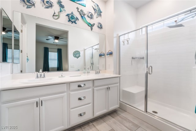 778 Dainty Daffodil St, Henderson, NV 89011 - bathroom with ceiling fan, a shower stall, and double vanity