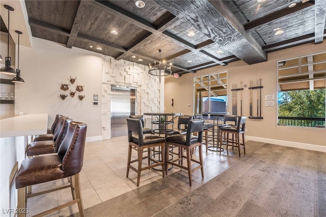 778 Dainty Daffodil St, Henderson, NV 89011 - tiled dining area with wooden ceiling, coffered ceiling, beam ceiling, baseboards, and a chandelier