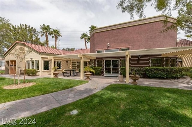7885 W Flamingo Rd Unit 2019, Las Vegas, NV 89147 - back of house featuring a pergola, a patio area, a yard, and stucco siding