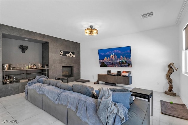 tiled living room featuring tile walls and a tiled fireplace