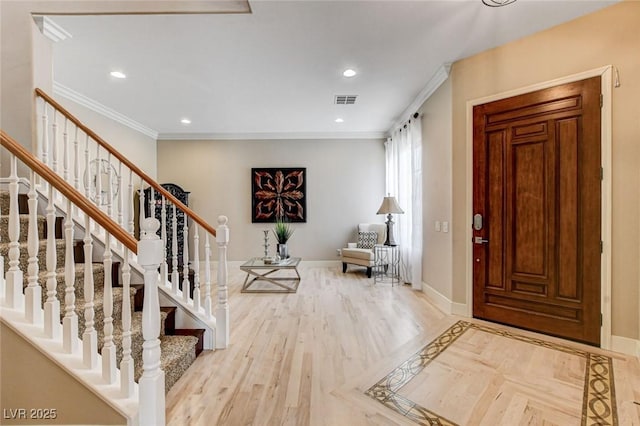 entrance foyer featuring baseboards, stairway, recessed lighting, wood finished floors, and crown molding