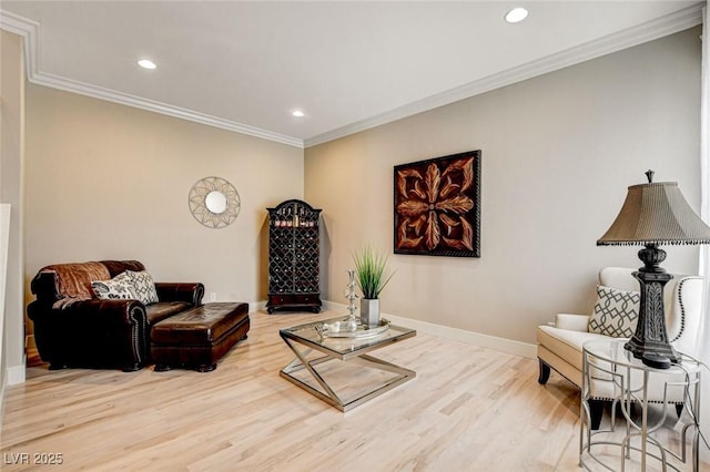 living area featuring wood finished floors, ornamental molding, recessed lighting, and baseboards