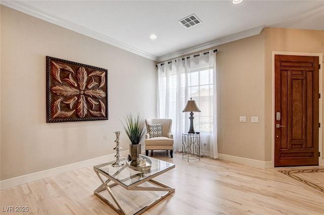 living area with ornamental molding, light wood-type flooring, baseboards, and recessed lighting