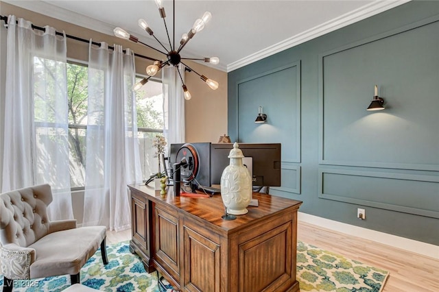 office space featuring a chandelier, crown molding, and light wood-type flooring