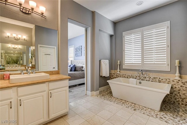 bathroom featuring a soaking tub, vanity, ensuite bathroom, and tile patterned flooring