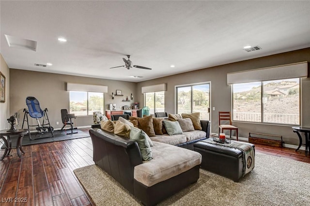 living area with recessed lighting, a ceiling fan, dark wood finished floors, and baseboards