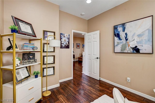 sitting room featuring baseboards and wood-type flooring