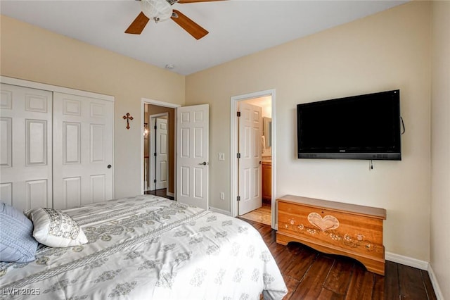 bedroom featuring baseboards, a closet, wood finished floors, ceiling fan, and ensuite bathroom