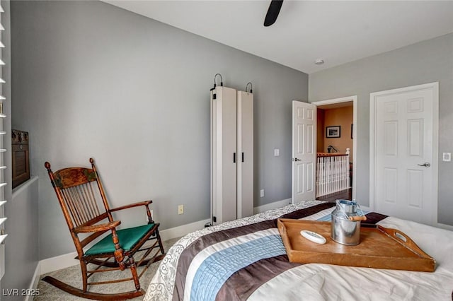 bedroom featuring carpet, baseboards, and a ceiling fan