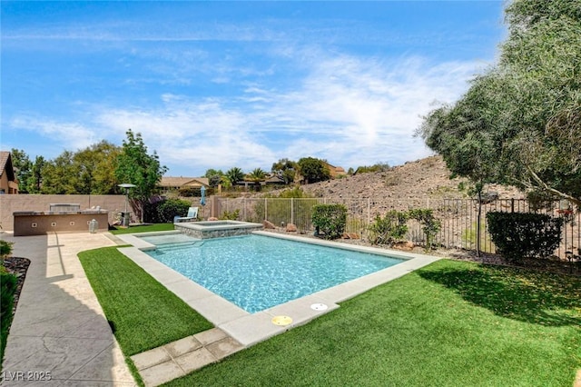 view of swimming pool with area for grilling, a patio, and a pool with connected hot tub