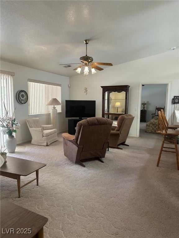 1461 E Elderberry St, Pahrump, NV 89048 - living area with light carpet and a ceiling fan