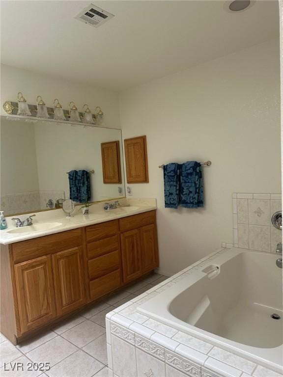 1461 E Elderberry St, Pahrump, NV 89048 - bathroom featuring double vanity, a bath, and tile patterned flooring