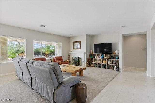 2612 Dearport Ct, Henderson, NV 89052 - carpeted living room featuring baseboards, a fireplace, and tile patterned flooring
