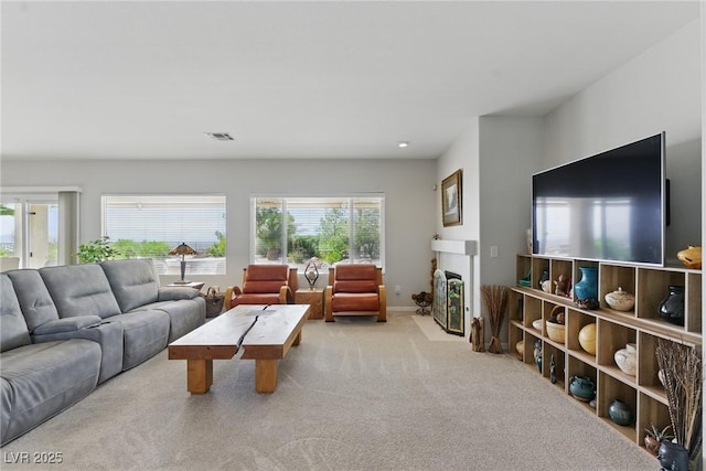 2612 Dearport Ct, Henderson, NV 89052 - carpeted living area featuring a fireplace with flush hearth