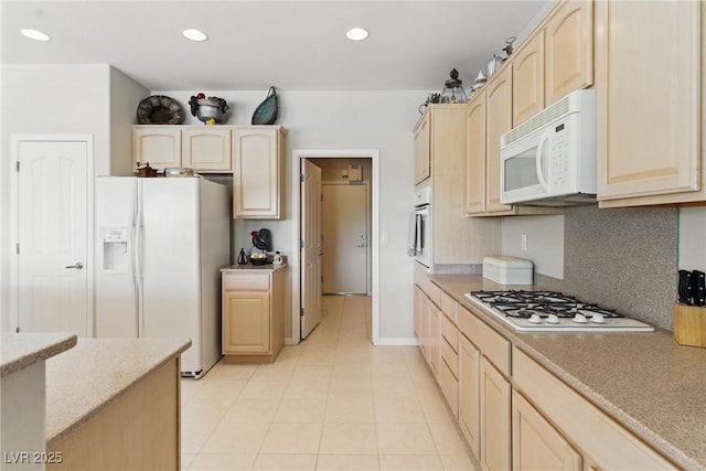 2612 Dearport Ct, Henderson, NV 89052 - kitchen with white appliances, light brown cabinets, light tile patterned flooring, recessed lighting, and backsplash