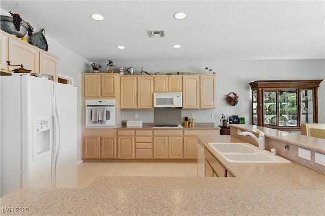 2612 Dearport Ct, Henderson, NV 89052 - kitchen featuring white appliances, a sink, light brown cabinets, recessed lighting, and light tile patterned flooring