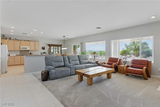 2612 Dearport Ct, Henderson, NV 89052 - living room with recessed lighting, plenty of natural light, baseboards, light tile patterned floors, and light carpet