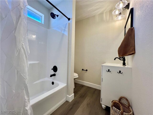 407 Tiger Lily Way, Henderson, NV 89015 - full bath featuring wood finished floors, toilet, shower / tub combo, vanity, and baseboards