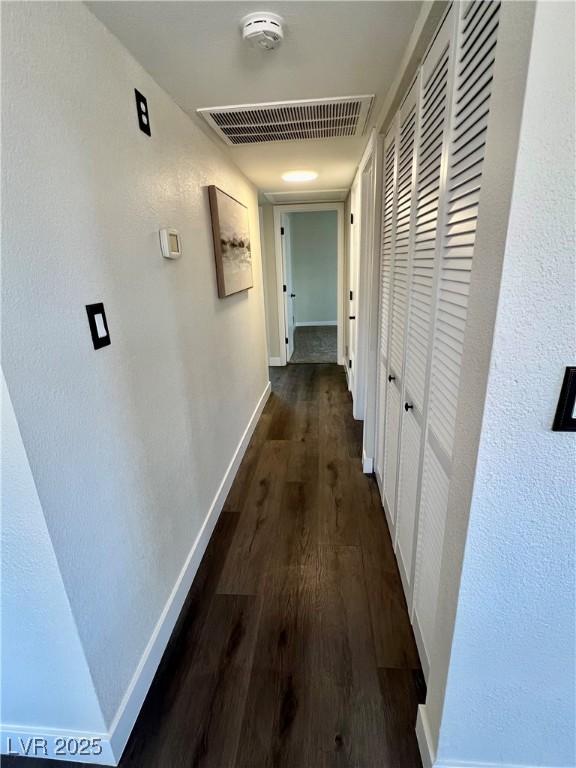 407 Tiger Lily Way, Henderson, NV 89015 - hallway featuring dark wood-style flooring and baseboards
