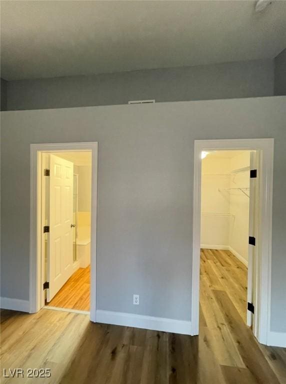 5165 Briar Meadow Way, Las Vegas, NV 89118 - unfurnished room featuring wood finished floors and baseboards