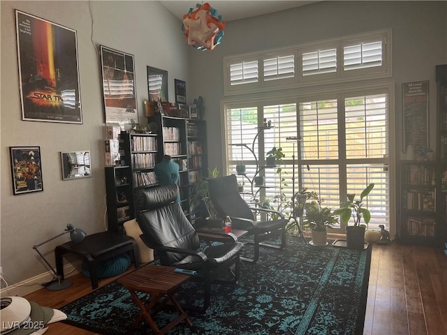 5165 Briar Meadow Way, Las Vegas, NV 89118 - living area with hardwood / wood-style floors, a desk, and a towering ceiling