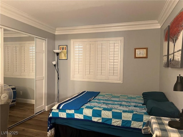5165 Briar Meadow Way, Las Vegas, NV 89118 - bedroom featuring wood finished floors, crown molding, a closet, and baseboards