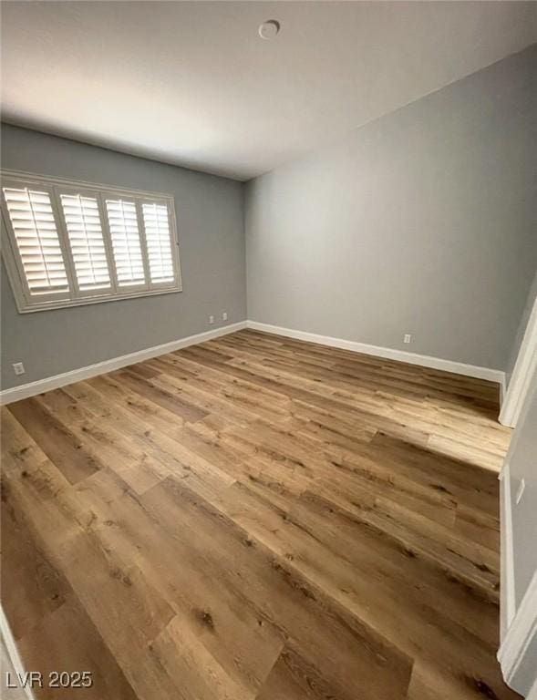 5165 Briar Meadow Way, Las Vegas, NV 89118 - empty room with wood finished floors and baseboards