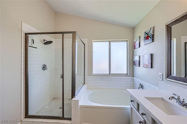 5502 Cinnamon Ave, Las Vegas, NV 89122 - full bath with vaulted ceiling, a bath, a stall shower, vanity, and tile patterned floors