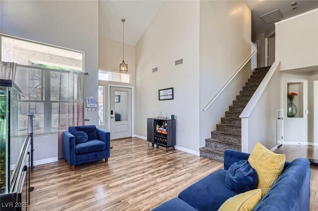 5502 Cinnamon Ave, Las Vegas, NV 89122 - foyer with high vaulted ceiling, wood finished floors, and baseboards