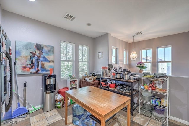 dining room with plenty of natural light, baseboards, and recessed lighting