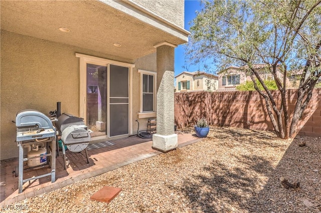 view of patio / terrace featuring fence