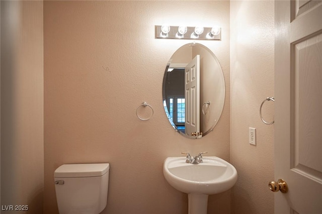 7500 Peaceful Brook St, Las Vegas, NV 89131 - half bathroom with toilet and a sink