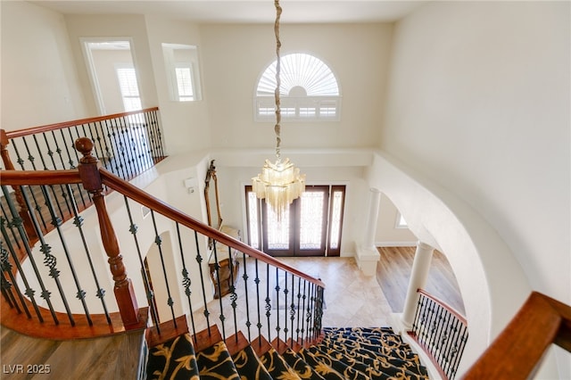 4542 Grey Spencer Dr, Las Vegas, NV 89141 - entrance foyer with healthy amount of natural light, a high ceiling, a chandelier, and arched walkways