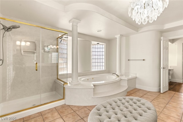 4542 Grey Spencer Dr, Las Vegas, NV 89141 - bathroom with tile patterned flooring, ornate columns, a garden tub, and a shower stall