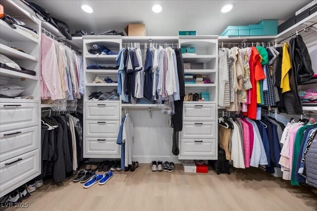 10470 Dove Meadow Way, Las Vegas, NV 89135 - spacious closet featuring wood finished floors