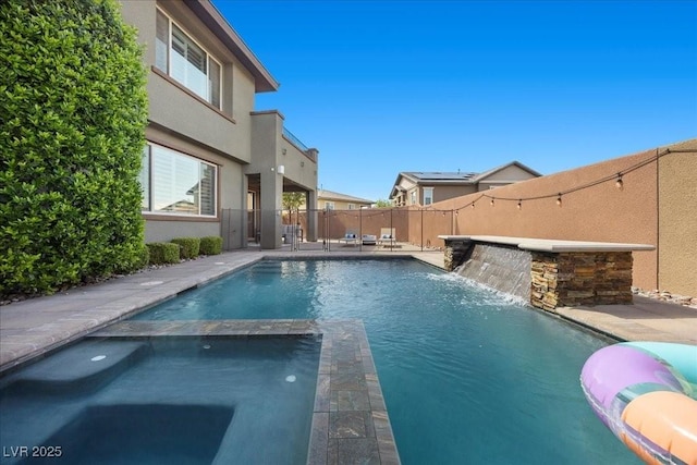 10470 Dove Meadow Way, Las Vegas, NV 89135 - view of pool with a fenced backyard, a pool with connected hot tub, and a patio area