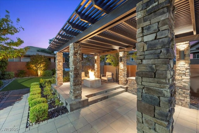 10470 Dove Meadow Way, Las Vegas, NV 89135 - patio terrace at dusk with a fire pit, a patio area, and a pergola
