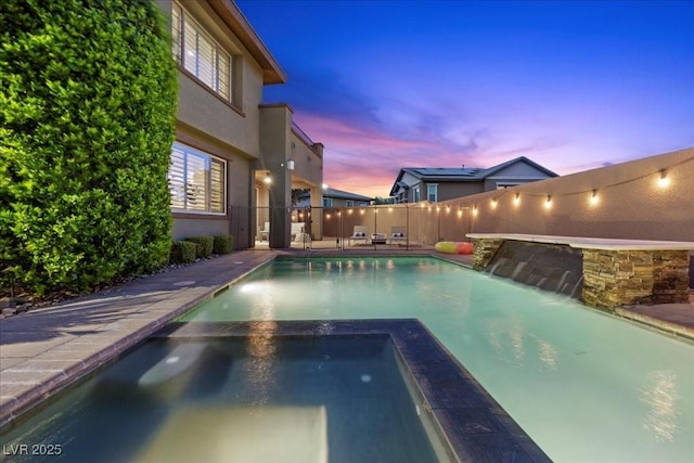 10470 Dove Meadow Way, Las Vegas, NV 89135 - view of swimming pool featuring a fenced backyard and a pool with connected hot tub