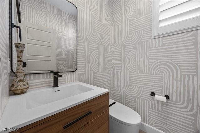 10470 Dove Meadow Way, Las Vegas, NV 89135 - half bath featuring wallpapered walls, vanity, and toilet